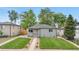 Charming home with a well-manicured lawn and a cozy patio area at 3541 Eudora St, Denver, CO 80207
