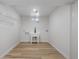 Bright laundry room features a utility sink, washer/dryer hookups, and wooden floor at 3541 Eudora St, Denver, CO 80207