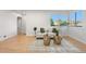 Stylish living room featuring hardwood floors, neutral decor, and plenty of natural light at 3541 Eudora St, Denver, CO 80207