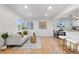 Bright living room with hardwood floors and a modern sofa at 3541 Eudora St, Denver, CO 80207