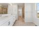 Bathroom with double sink vanity, walk-in shower and tiled flooring at 7267 Prairie Sage Pl, Littleton, CO 80125