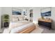 Bright bedroom with a plush rug, modern furniture, closet, and stylish decor at 7267 Prairie Sage Pl, Littleton, CO 80125