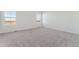 Neutral bedroom featuring carpeted floors, white walls and natural light at 7267 Prairie Sage Pl, Littleton, CO 80125