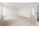 Bright bedroom with clean carpeting and a large window at 7267 Prairie Sage Pl, Littleton, CO 80125