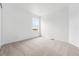 Bright bedroom featuring a large window with an outdoor view at 7267 Prairie Sage Pl, Littleton, CO 80125