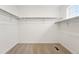Walk in closet with shelving and carpeting at 7267 Prairie Sage Pl, Littleton, CO 80125