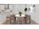 Dining room with table, chairs, modern light fixture, and hardwood floors at 7267 Prairie Sage Pl, Littleton, CO 80125