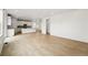 Open-concept space featuring hardwood floors, eat-in kitchen, and recessed lighting at 7267 Prairie Sage Pl, Littleton, CO 80125