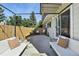 Charming backyard patio featuring comfortable lounge seating and a privacy fence at 6795 E Arizona Ave # B, Denver, CO 80224