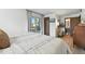 Bright bedroom featuring a balcony, neutral color scheme, and a blend of textures for a comfortable ambiance at 6795 E Arizona Ave # B, Denver, CO 80224