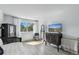 Bright bedroom featuring contemporary furniture, natural light, and light wood flooring at 6795 E Arizona Ave # B, Denver, CO 80224