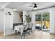 Bright dining area with a modern table and sliding glass doors at 6795 E Arizona Ave # B, Denver, CO 80224
