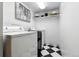 Bright laundry room with a checkered floor and modern appliances at 6795 E Arizona Ave # B, Denver, CO 80224