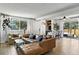 Open living room features modern furniture and a dining table at 6795 E Arizona Ave # B, Denver, CO 80224