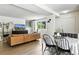 Combined living and dining area with leather sectional at 6795 E Arizona Ave # B, Denver, CO 80224