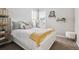 Bedroom featuring modern decor, neutral walls and carpet, and light-filled windows at 8883 Ramblestone St, Highlands Ranch, CO 80129