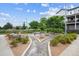 Beautifully landscaped common area with walking paths and bench seating at 8883 Ramblestone St, Highlands Ranch, CO 80129