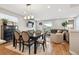 Open living space with dining area, inviting living room and lots of natural light at 8883 Ramblestone St, Highlands Ranch, CO 80129