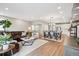 Open living space with dining area, inviting living room and lots of natural light at 8883 Ramblestone St, Highlands Ranch, CO 80129