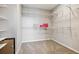 Spacious walk-in closet featuring neutral carpet and metal shelving for optimal storage at 8883 Ramblestone St, Highlands Ranch, CO 80129