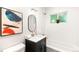 Cozy bathroom featuring a tub, vanity with dark cabinet, and natural light at 3054 S Raleigh St, Denver, CO 80236