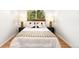 Well-lit bedroom with a cozy bed, stylish pillows, and dark wood bedside tables at 3054 S Raleigh St, Denver, CO 80236