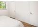 Bright bedroom featuring neutral decor, light colored bedding, and natural light at 3054 S Raleigh St, Denver, CO 80236