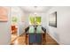Elegant dining room with a glass-top table and stylish decor at 3054 S Raleigh St, Denver, CO 80236