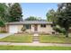 Charming ranch-style home with a well-maintained front yard and a classic brick exterior at 3054 S Raleigh St, Denver, CO 80236