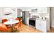 Modern kitchen featuring stainless steel appliances, granite countertops, and a cozy breakfast nook at 3054 S Raleigh St, Denver, CO 80236