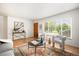 Bright living room showcasing hardwood floors, contemporary decor, and a large window at 3054 S Raleigh St, Denver, CO 80236