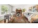 Bright living room with hardwood floors, stylish furnishings, and a cozy fireplace at 3054 S Raleigh St, Denver, CO 80236