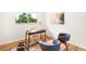 Bright office space with desk, stylish chairs, and natural light from the window at 3054 S Raleigh St, Denver, CO 80236