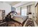 Bedroom boasts a large bed, stylish decor, and lots of natural light at 9995 E Harvard Ave # 221, Denver, CO 80231