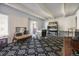 Open living space features stylish rug, bright natural light, and comfortable seating arrangement at 9995 E Harvard Ave # 221, Denver, CO 80231
