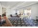 Bright living area with large windows, unique flooring, and access to the outdoor balcony at 9995 E Harvard Ave # 221, Denver, CO 80231