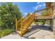 Outdoor living space with deck stairs that create a shaded seating area underneath at 11462 W Tennessee Pl, Lakewood, CO 80226