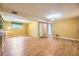 Finished basement with vinyl floors and natural light from a window at 11462 W Tennessee Pl, Lakewood, CO 80226