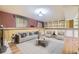 Finished basement offers ample living space with built-in shelving and comfortable seating at 11462 W Tennessee Pl, Lakewood, CO 80226