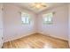 Bright bedroom with hardwood floors and natural light from two windows at 11462 W Tennessee Pl, Lakewood, CO 80226