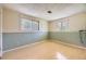 Finished bedroom with parquet floors, wainscotting and natural light from two windows at 11462 W Tennessee Pl, Lakewood, CO 80226