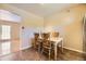 Bright dining area featuring four wooden chairs and tile floors at 11462 W Tennessee Pl, Lakewood, CO 80226