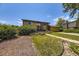 Exterior of a well-maintained two-story house with front yard featuring mature landscaping and an attached garage at 11462 W Tennessee Pl, Lakewood, CO 80226