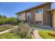 Charming home featuring a mix of brick and siding, complemented by vibrant landscaping and a well-kept lawn at 11462 W Tennessee Pl, Lakewood, CO 80226