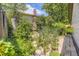 Serene garden with stone pathway, lush foliage, and colorful flowers adding natural beauty at 11462 W Tennessee Pl, Lakewood, CO 80226