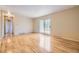 Spacious living room with hardwood floors and sliding doors for natural light and easy outdoor access at 11462 W Tennessee Pl, Lakewood, CO 80226