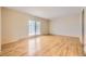 Bright living room featuring hardwood floors and sliding glass doors leading to an outdoor area at 11462 W Tennessee Pl, Lakewood, CO 80226
