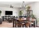 Bright living room and eat-in kitchen area features furniture, modern shelving, and plush carpeting at 9535 Dexter Ln, Thornton, CO 80229