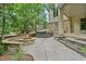 The backyard has a stone fire pit with seating, and a private hot tub on a stone patio at 11465 W Atlantic Ave, Lakewood, CO 80227