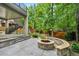 Relax by the outdoor fire pit with stone seating, or enjoy the play set in this lush, green backyard at 11465 W Atlantic Ave, Lakewood, CO 80227
